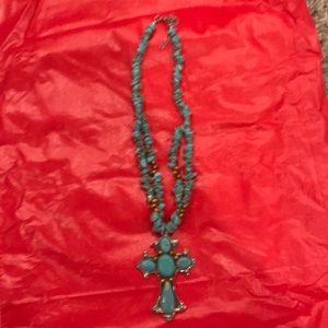 Turquoise cross necklace.